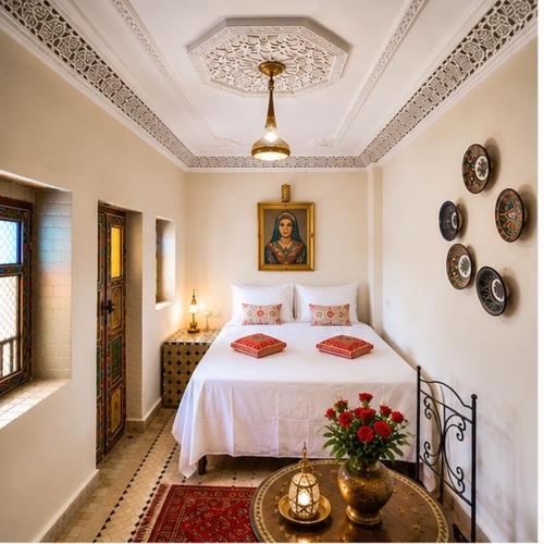 a bedroom with a bed in a room at Riad Fes Layan in Fez
