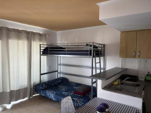 a small room with a bunk bed in it at Apt in Playa den Bossa next Ushuaia, beachfront, reliable host in Ibiza Town