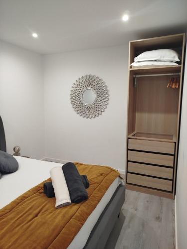 a bedroom with a bed and a dresser at Casa do Ginjão in Alcobaça