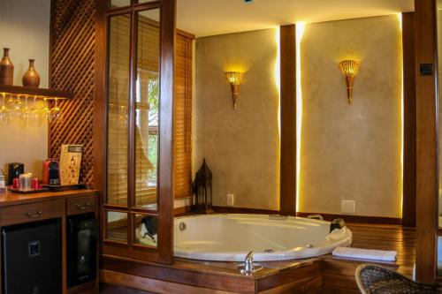 a large bath tub in a room with at Pousada Meu Talento in Alto Paraíso de Goiás