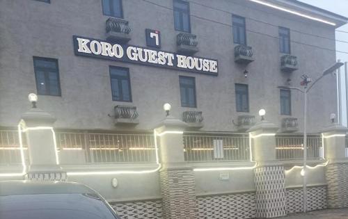 a car parked in front of a korea guest house at Koro Guess House in Lagos