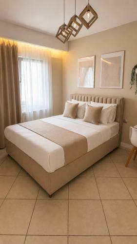 a bedroom with a large bed in a room at Florina Modern Studio in Florina