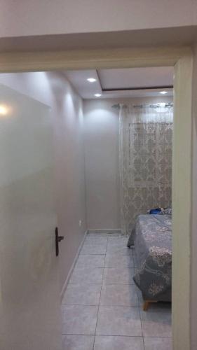 a room with a bedroom with a bed in it at Grand joli F3 Draria 7P in Draria