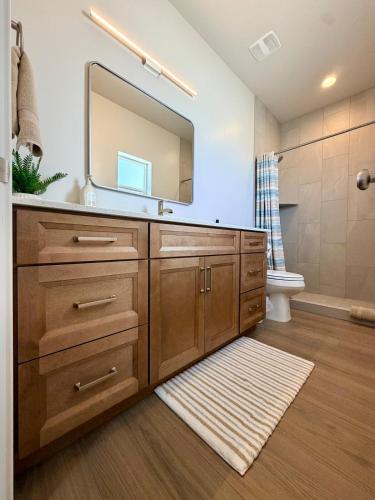 a bathroom with a sink and a mirror at Desert Sun Oasis in Page