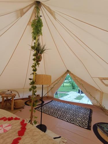 a room with a tent with plants on it at Tente entre Vichy et le PAL " ô Rêves Atypiques" in Boucé