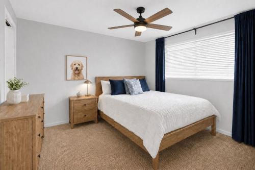 a bedroom with a bed and a ceiling fan at Vail Pines Stay in Vail