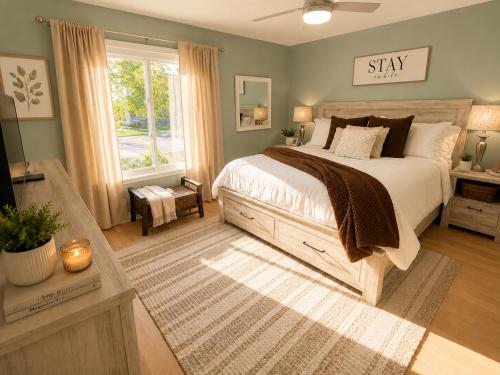 a bedroom with a large bed and a window at Private Beach, 2 Pools & Hot Tub in St. Petersburg