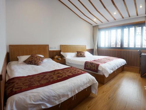 Krevet ili kreveti u jedinici u okviru objekta Wuzhen On Memory Inn