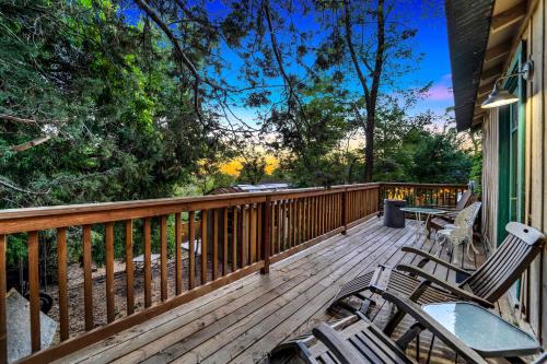 a deck with chairs and tables on a house at Escape to Rustic Studio Fireplace Modern Comfort in Julian
