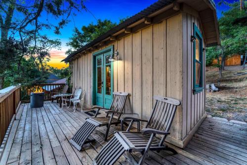 a wooden deck with chairs and a house at Escape to Rustic Studio Fireplace Modern Comfort in Julian