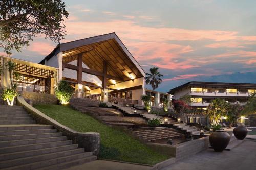 a building with stairs in front of a building at Grand Luley Manado in Manado
