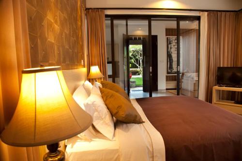 Ένα ή περισσότερα κρεβάτια σε δωμάτιο στο Muaya Villa
