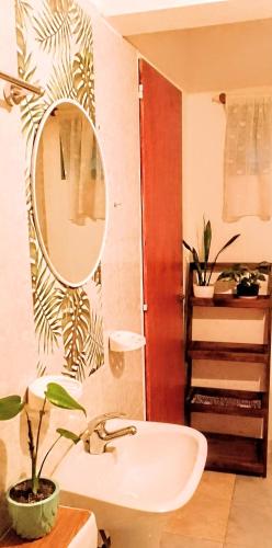 a bathroom with a sink and a mirror at Teros in Caleta Olivia