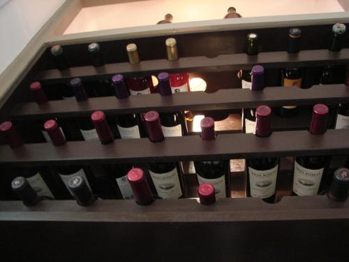 a bunch of wine bottles in a wine cellar at Bohemia Hotel Boutique in Mendoza