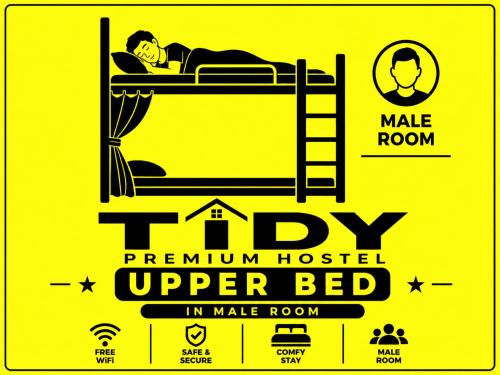 a poster of a man sleeping on a bunk bed at TIDY Premium Hostel, Sharjah in Sharjah