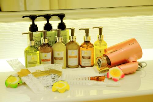 a group of wine bottles sitting on top of a counter at Spa&Capsule Hotel Grandpark Inn Kitasenju in Tokyo
