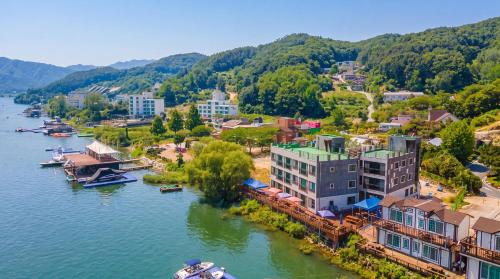 an aerial view of a town next to a river at Gapyeong Rialto Pension in Gapyeong