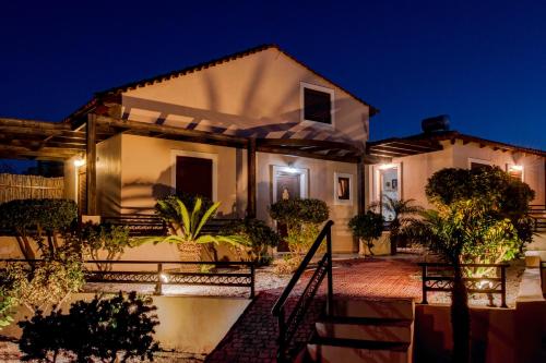 a house at night with lights at Kyriaki's Cozy Apartments in Agia Marina Nea Kydonias