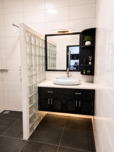 a bathroom with a sink and a mirror at Bugbug Beach Resort in Gili Biaha