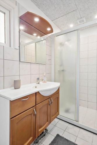 a bathroom with a sink and a shower at S742-Stroby-Garderhojen-32 in Strøby