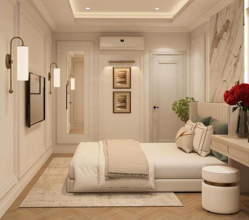 a bedroom with a white bed and a table at My Eliana Luxury Hotel Saigon Saigon & Spa in Ho Chi Minh City
