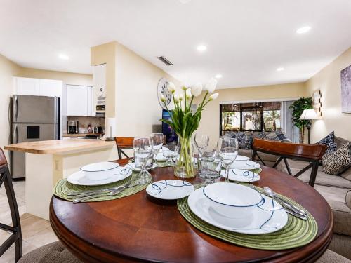 a dining room table with plates and glasses on it at 3608 Orlando Vacational 1st floor in Orlando