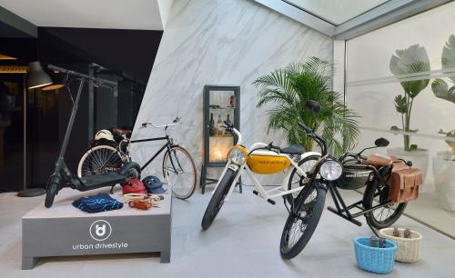 two bikes on display in a room with plants at INNSiDE by Meliá Palma Bosque in Palma de Mallorca