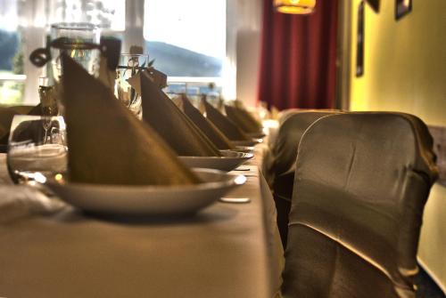 a row of seats at a table in a restaurant at Hotel Andromeda in Ostružná