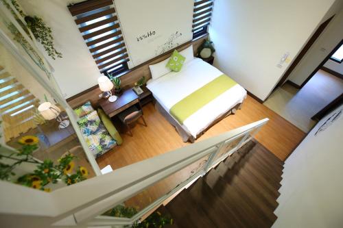 Postel nebo postele na pokoji v ubytování 雲起軒民宿 Cloudscape B&B