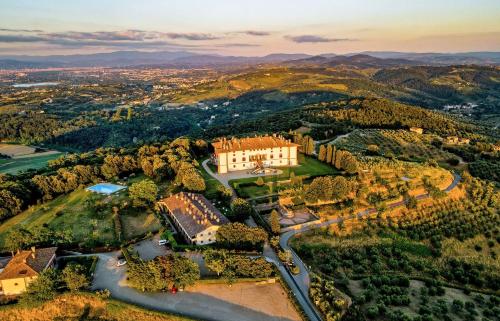 an aerial view of a mansion on a hill at Hotel Tenuta di Artimino member of Meliá Collection in Artimino