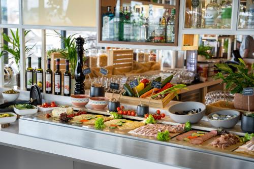 a buffet with many different types of food at INNSiDE by Meliá Aachen in Aachen