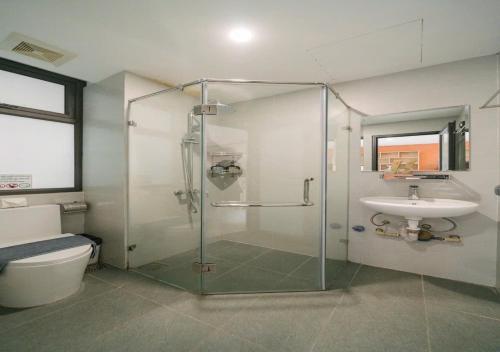 a bathroom with a glass shower and a sink at BOHO Homestay Hanoi - No81 Alley 8 Ton That Thiep in Hanoi