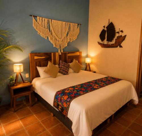a bedroom with a large bed in a room at Hotel Boutique Sol y Luna SPA in Ajijic