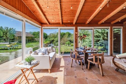 a living room filled with furniture and a table at Family Retreat near Zagreb with Pool & Garden - Happy Rentals in Velika Buna