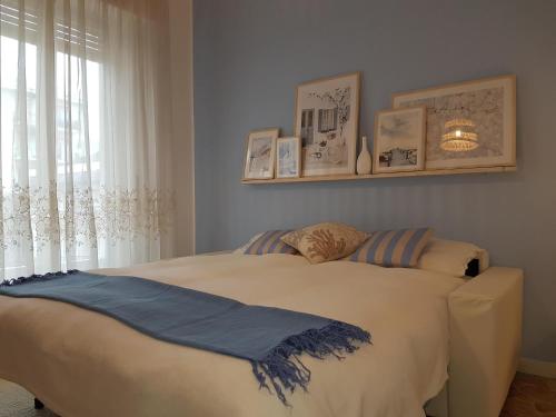 a bedroom with a large bed with a window at Il Cuore di Santa è tutto blu in Santa Margherita Ligure