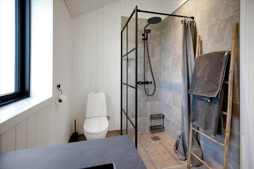 a bathroom with a shower and a toilet at 13397-Vig-Lyngkrogen-21 in Vig