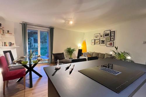 A modern apartment a terrace and a garden