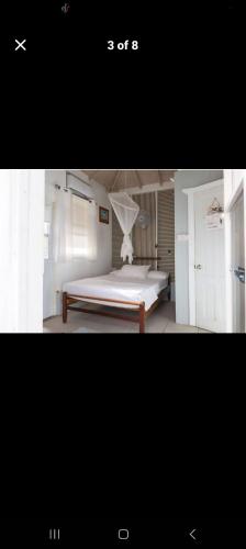 a picture of a bedroom with a bed at Cosy Hut in Saint Georgeʼs