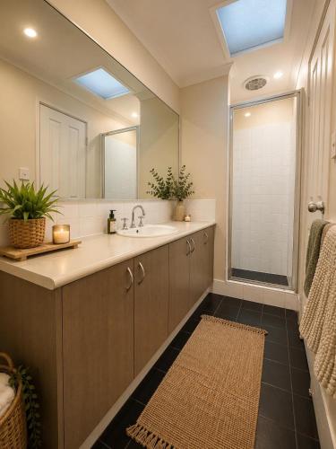 a bathroom with a sink and a mirror at Coastal Haven Retreat 3BR Escape in Kinross in Kinross