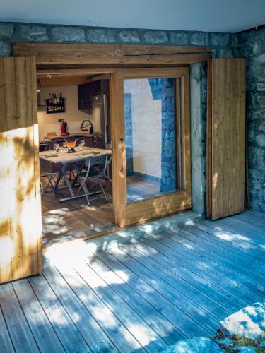 a room with a sliding glass door in a house at Ski Chalet located Meribell in Les Allues