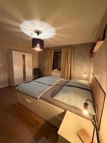 a bedroom with a large bed in a room at Ferienwohnung Ehrenberg-Feeling in Ehrenberg