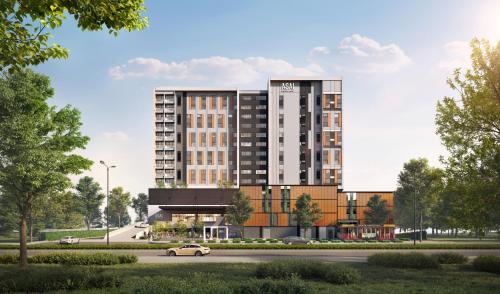 a rendering of a building with a road in front at ASAI Gamuda Cove in Banting