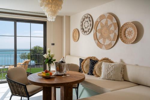 a living room with a couch and a table at Anantasila Beach Resort Hua Hin in Hua Hin