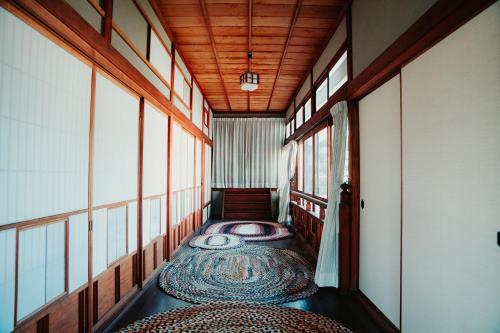 a hallway with a room with a table in it at Kacho-en / Vacation STAY 1048 in Mitoyo