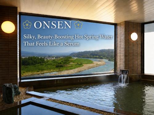 a sign for a swimming pool in a building with a large sign for a river at Yoshinotei in Iida