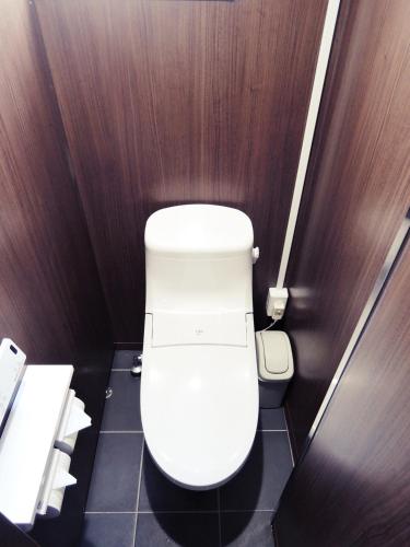 a small bathroom with a white toilet in a stall at HOTEL LUCKY / Vacation STAY 4266 in Osaka
