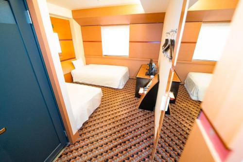 a small room with two beds and a mirror at Hashima - Hotel - Vacation STAY 50945v in Hashima
