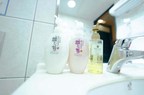 a bathroom sink with two bottles of moisturizers on it at Hashima - Hotel - Vacation STAY 50945v in Hashima