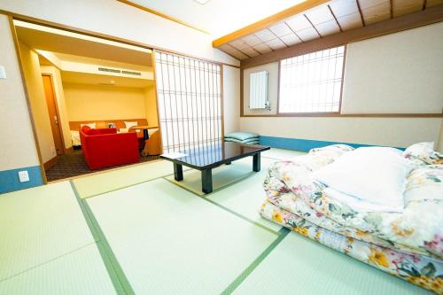 a living room with a couch and a table at Hashima - Hotel - Vacation STAY 52815v in Hashima