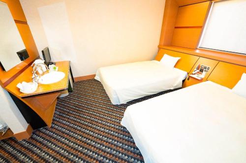 a hotel room with two beds and a sink at Hashima - Hotel - Vacation STAY 51161v in Hashima